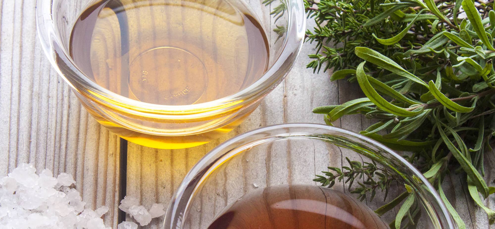 Photo shows two different types of vinegars in little serving bowls